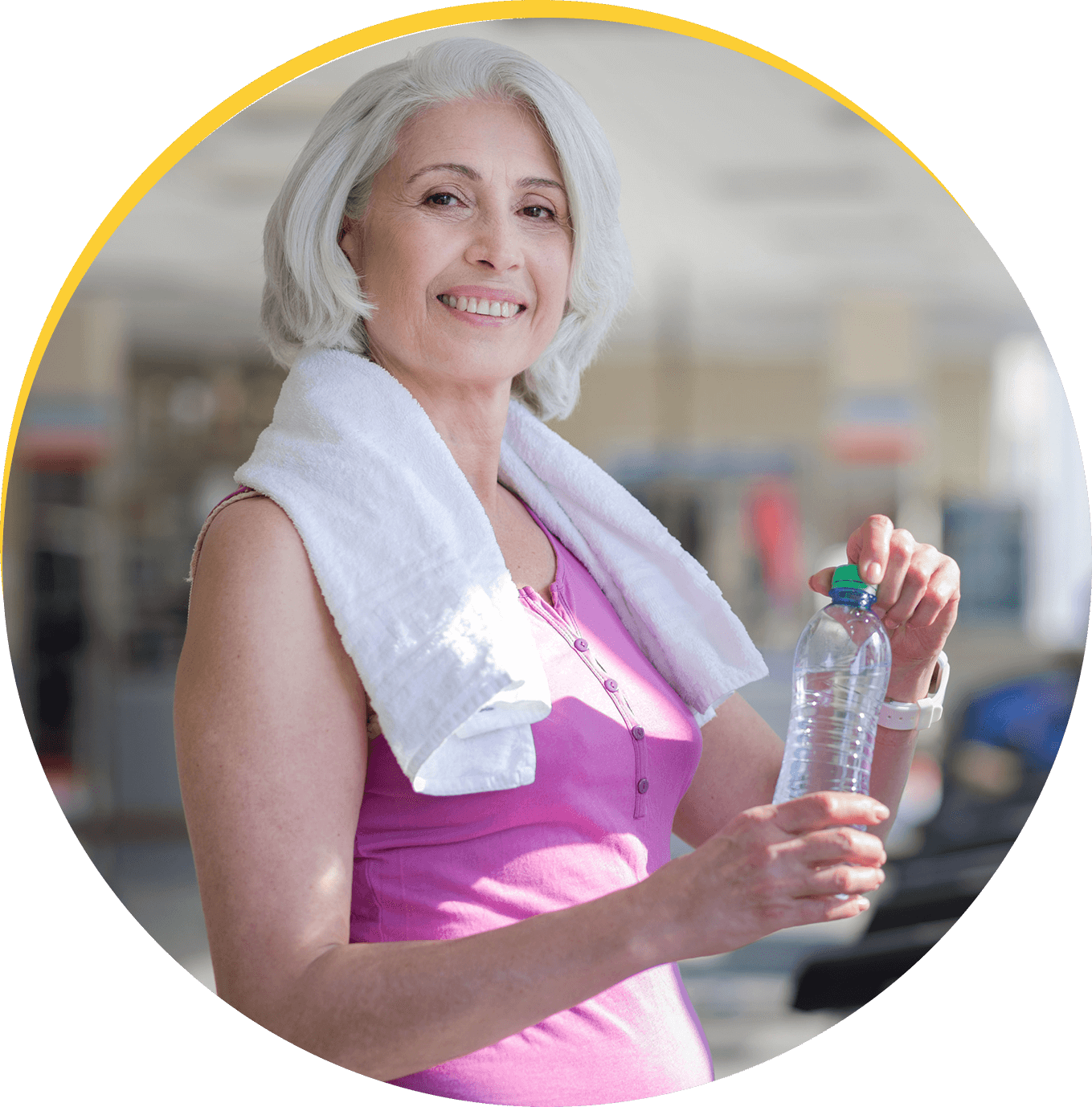 t1 (1) Woman holding water bottle, wearing gym towel.