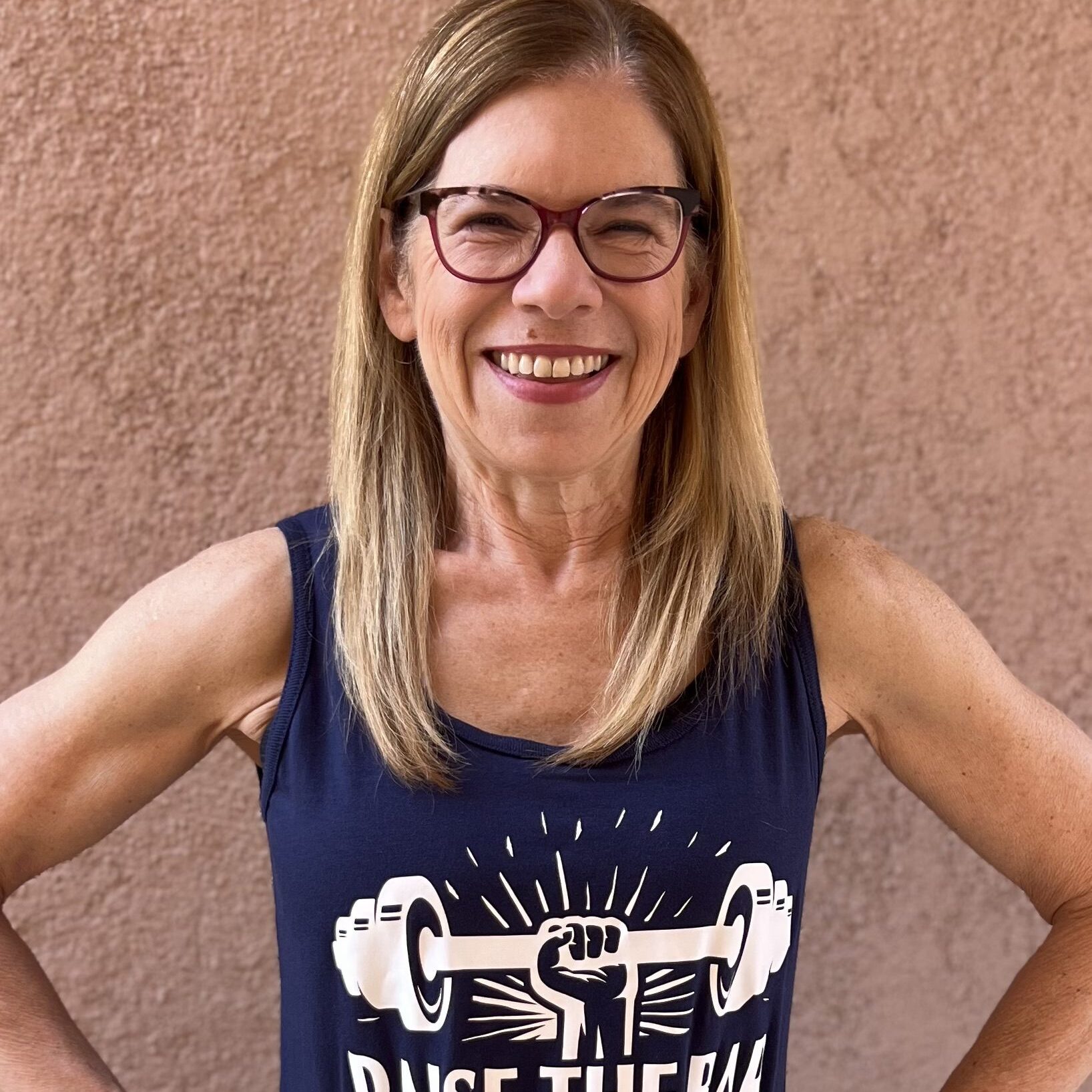 Smiling woman in "Raise the Bar" shirt. Smiling woman in "Raise the Bar" shirt.